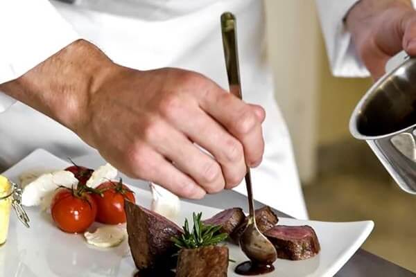 Chef plating food