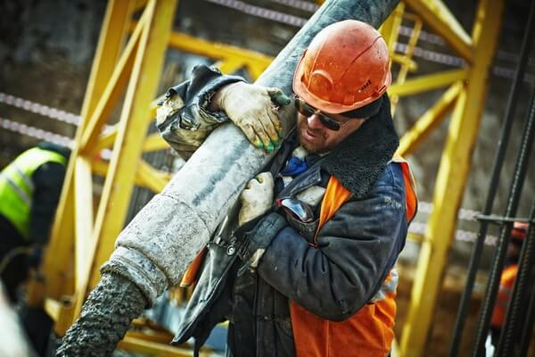 Man pumping concrete